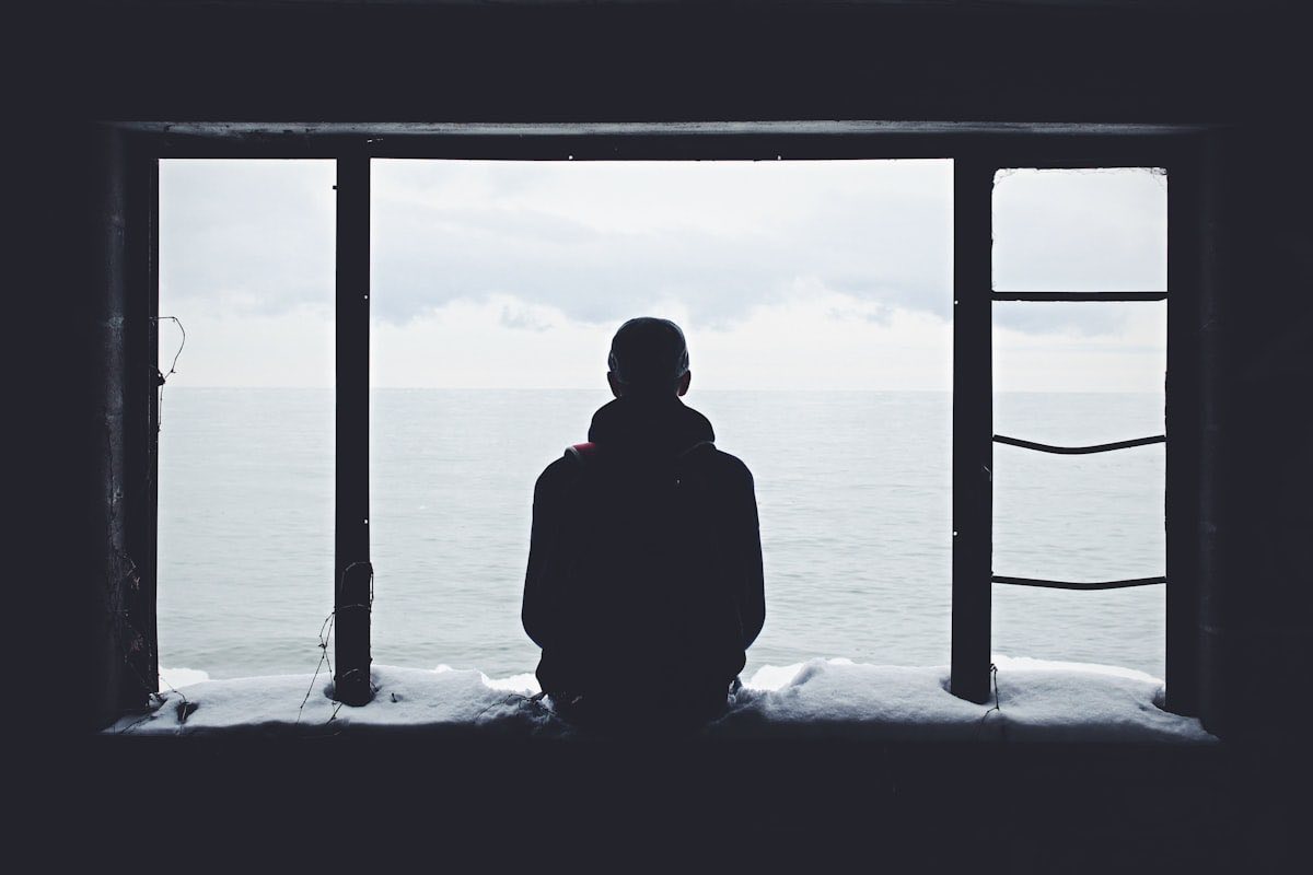 Person looking out window